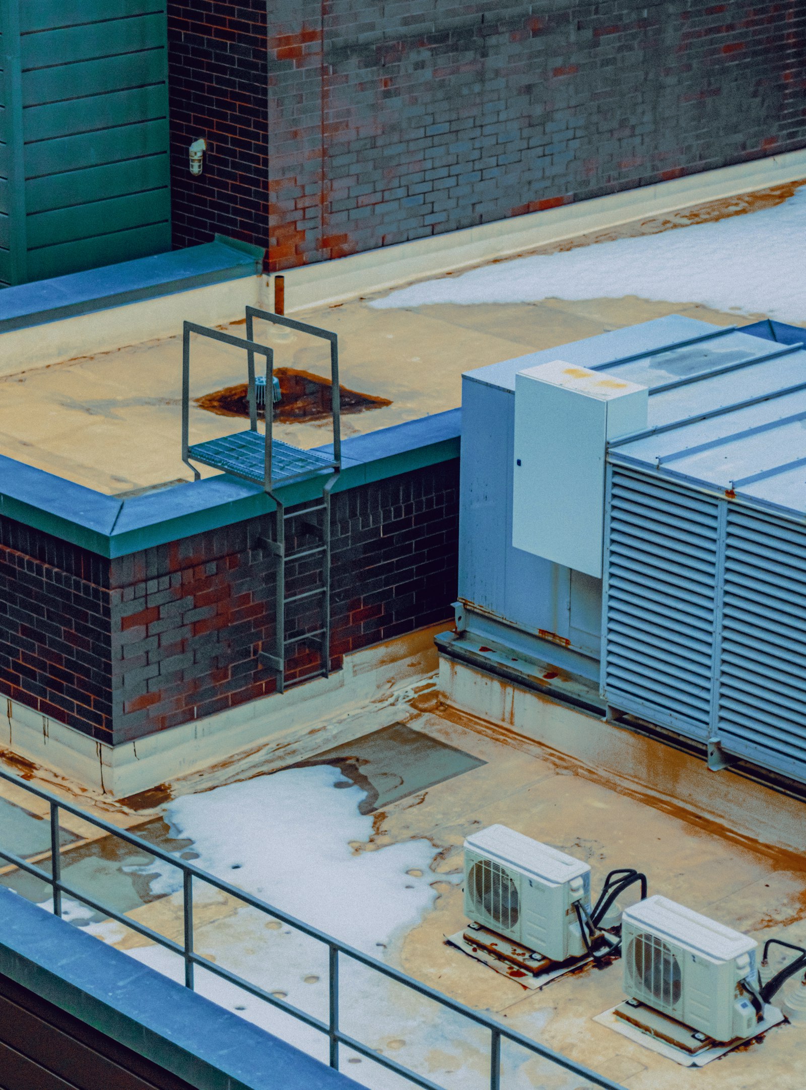 Rooftop packed with HVAC condenser units on a commercial building